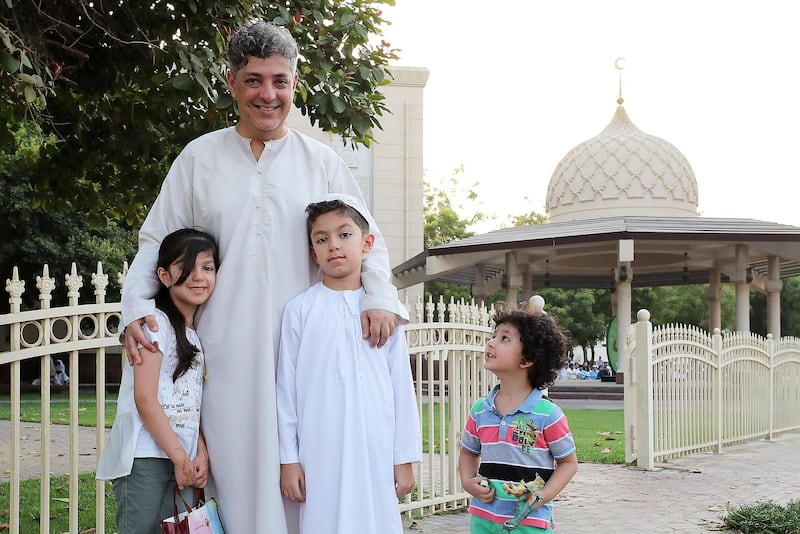 DUBAI, UNITED ARAB EMIRATES, August 21 – 2018 :- Riad Alrabie with his children Samaa ( left ), Ahmed (center) and Aws ( right ) after the Eid Al Adha prayers at the Jumeirah Mosque in Dubai. ( Pawan Singh / The National )  For News. Story by Nawal
