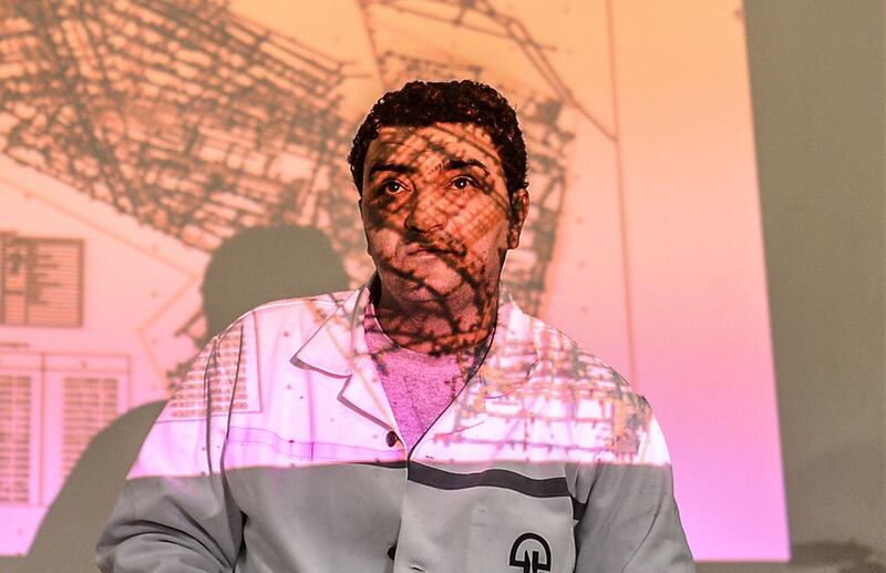Akin Celik, the operating manager of the Soma Coal Mining Company, stands as a map of the mine where an explosion killed at least 284 workers two days ago is projected on wall, during a press conference Soma, Turkey. Bulent Kilic / AFP Photo