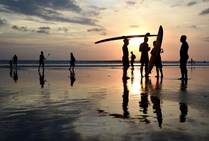 Faced with growing hostility in the US, Iranian Kurd-American teenager Rez goes on a surfing trip to Bali, where his faith awakens, with far-reaching consequences, in A Good Country. Sonny Tumbelaka / AFP