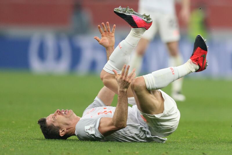 Robert Lewandowski grimaces after a tackle by Al Ahly's Hamdi Fathi. AP