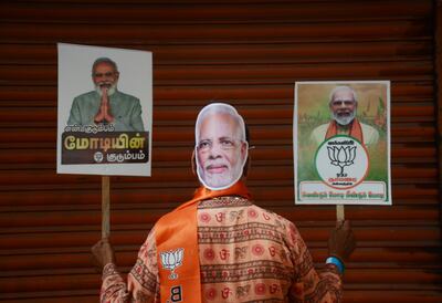 A Bharatiya Janata Party supporter shows faith in Prime Minister Narendra Modi during an election campaign in Chennai. AP