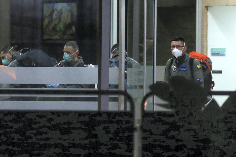 A member of the Colombian air force is seen at the entrance of a sports village, where Colombians who return from China will be isolated, in Bogota, Colombia February 28, 2020. REUTERS/Luisa Gonzalez