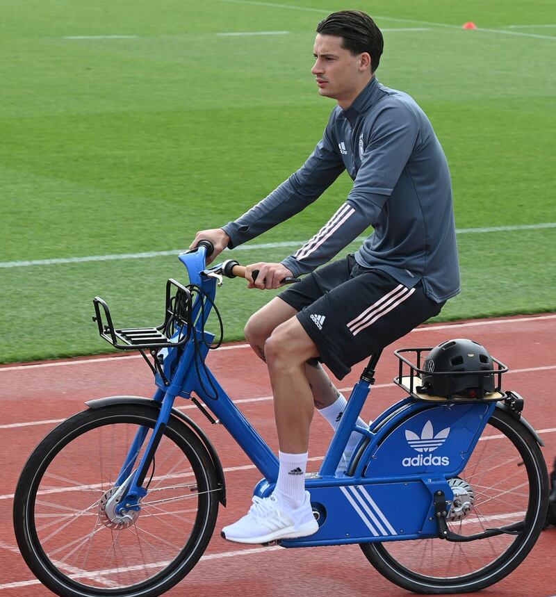 German defender Robin Koch arrives on a bicycle. AFP