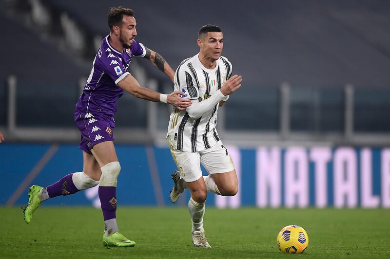 Cristiano Ronaldo runs with the ball during Juventus' match against Fiorentina. AP