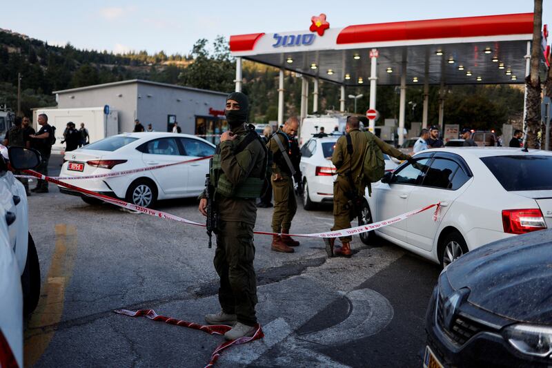 Security personnel work at the scene of the shooting near the Israeli settlement of Eli in the occupied West Bank. Reuters