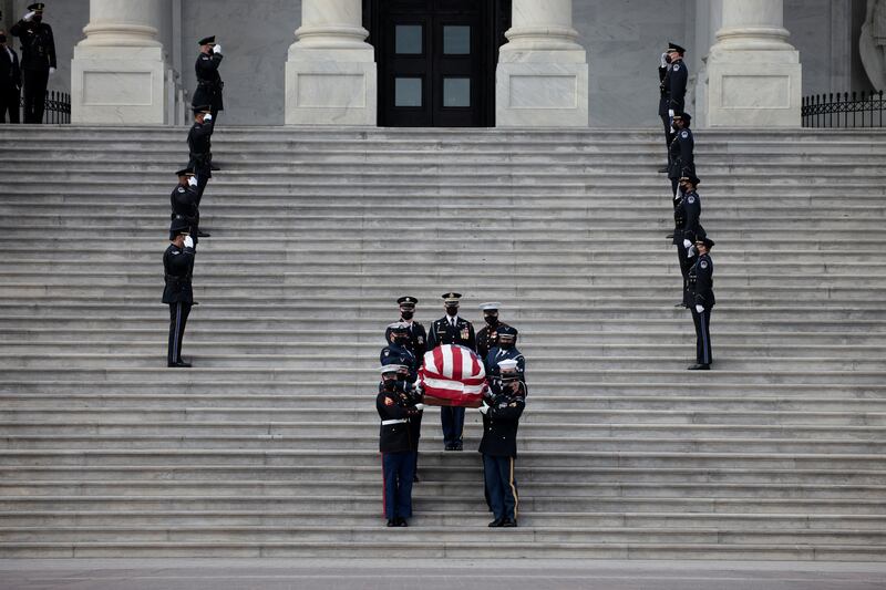 The casket is carried down the stairs of the US Capitol building. Reuters