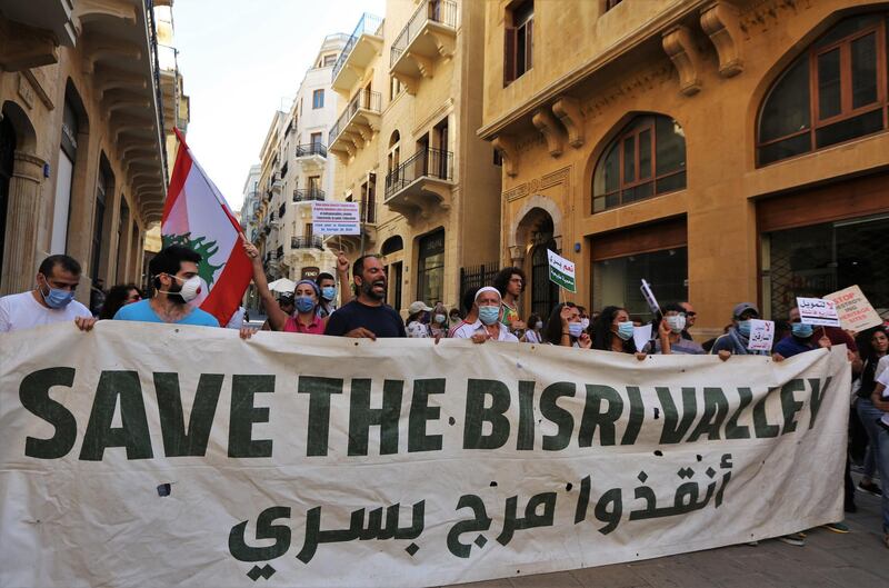 Anti-government Protestors carry placards and shout slogans against the Bisri Dam in front of the World Bank office in downtown Beirut, Lebanon.  EPA