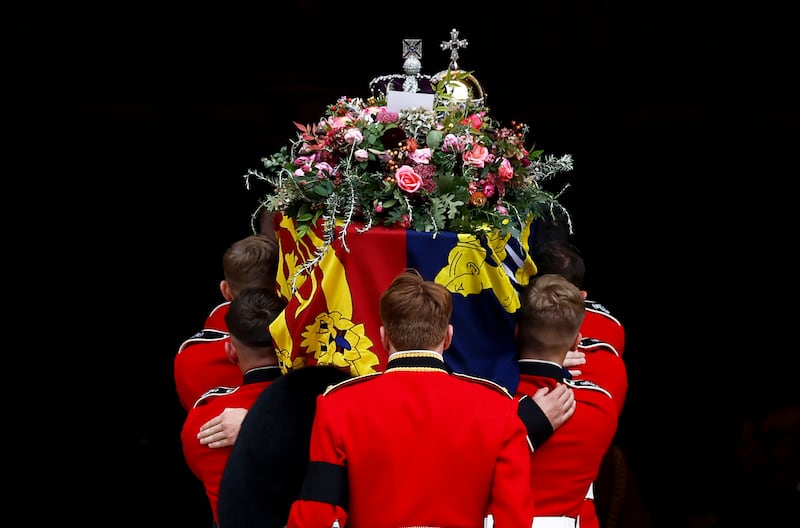 Pall bearers carry the coffin into St. George's Chapel, in Windsor. AP