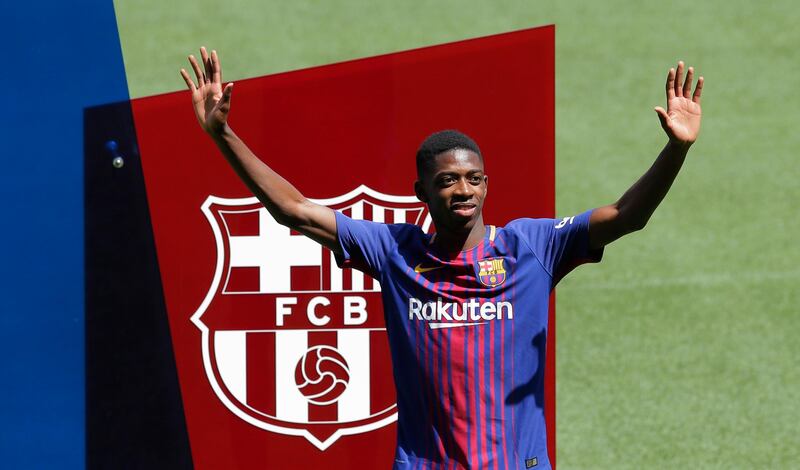 French soccer player Ousmane Dembele gestures during official presentation at the Camp Nou stadium in Barcelona, Spain, Monday, Aug. 28, 2017. Barcelona is shoring up its attack following Neymar's departure by buying Ousmane Dembele from Borussia Dortmund in a deal that could reach 147 million euros (about US dollars 173 million). (AP Photo/Manu Fernandez)