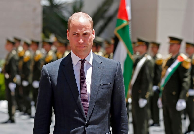 Britain's Prince William reviews honour guards before meeting with the Palestinian President Mahmud Abbas in the West Bank city of Ramallah.  Abbas Momani / AFP