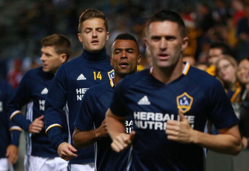 LA Galaxy players Steven Gerrard, Robbie Rogers, Ashley Cole and Robbie Keane warm up before they played their MLS season opener on Sunday. Victor Decolongon / Getty Images / AFP / March 6, 2016 