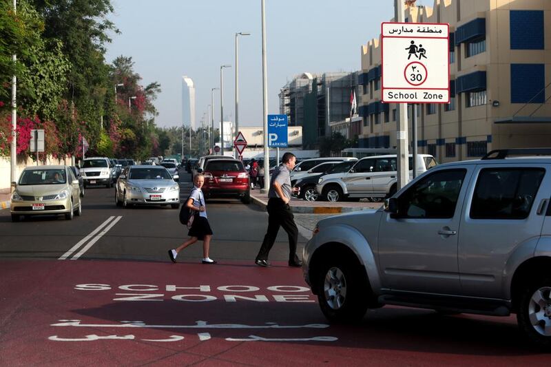 Motorists must observe the 30kph speed limit and yield the right of way to children at school crossings. Christopher Pike / The National