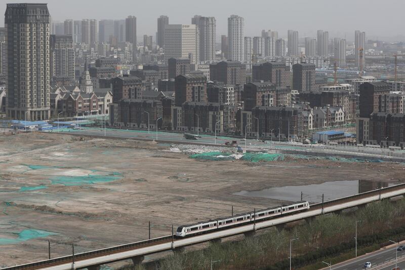 epa06674070 A view shows a light rail train running in Tianjin, China, 17 April 2018. China's gross domestic product (GDP) grew 6.8 percent in the first quarter of 2018, according to a report from China's National Bureau of Statistics on 17 April 2018.  EPA/WU HONG