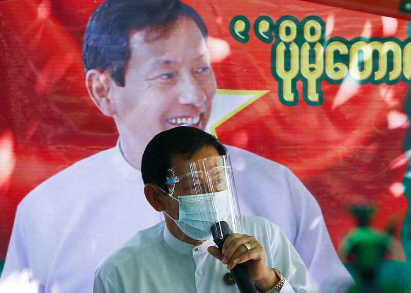 Than Htay, chairman of the military-aligned opposition Union Solidarity and Development Party (USDP), wears a face shield and a mask speaks during a campaign in Naypyidaw, Myanmar, for the November 8 national elections. AFP