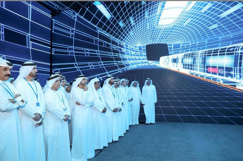 Sheikh Hamdan and his accompanying delegation watch a film titled “time trip” in the multi-screen hall equipped with 360˚ virtual reality technology. Wam