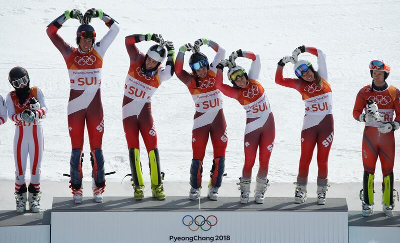 Switzerland's alpine skiing team celebrate during the victory ceremony at the 2018 Winter Olympics. Mike Segar / Reuters