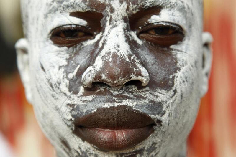 An Ivorian man with a painted face poses attends the Generation festival in Cocody village, Ivory Coast. The three century old festival honours the Ebrie people, members of the ethnic group Akan, who are best known for the large kingdom of Ashante, which evolved into what is now Ghana. The western most Akan peoples, the Agni, Baoul, and several smaller groups are descendants of people who fled from Ashante and now make up about one fifth of the Ivorian population. Each year the Ebrie gather to honour their ancestry. Legnan Koula / EPA