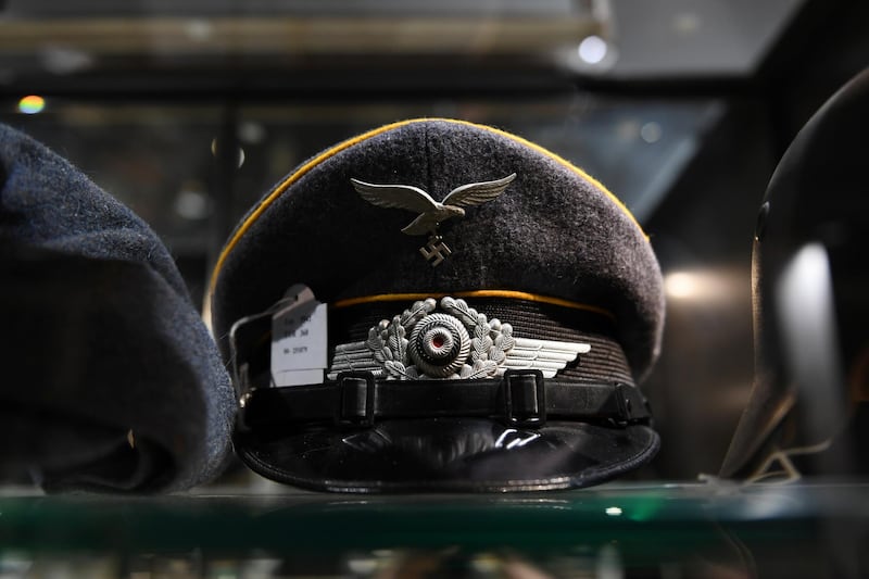 A Nazi-era Luftwaffe insignia is seen on a hat in a cupboard at the auction house Hermann Historica in Munich. Reuters