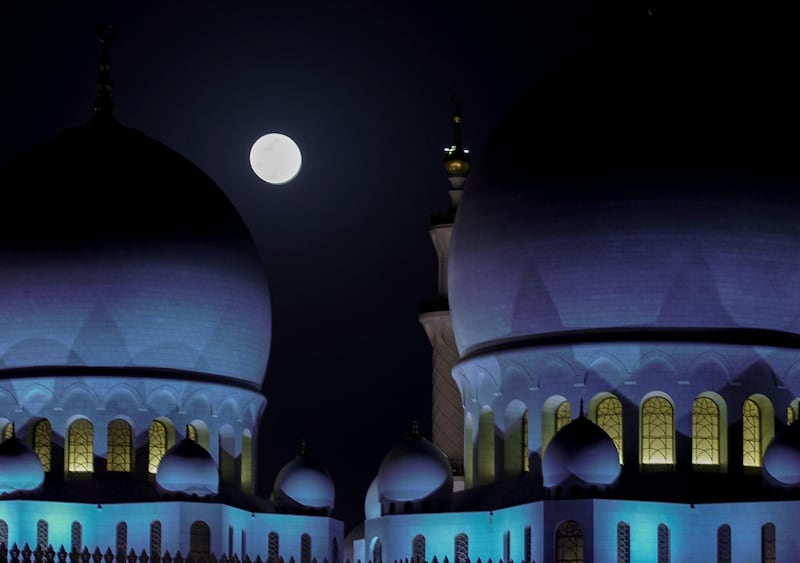 Abu Dhabi, United Arab Emirates, April 8, 2020.  The Supermoon rises over the Sheikh Zayed Grand Mosque.
Victor Besa / The National
Section:  NA
Reporter: