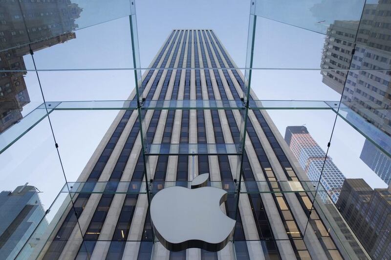 The Apple logo at its 5th Avenue location in New York. Demand for the iPhone 6 and 6 Plus is putting Apple on pace for its highest annual profit since 2012. John Taggart / EPA