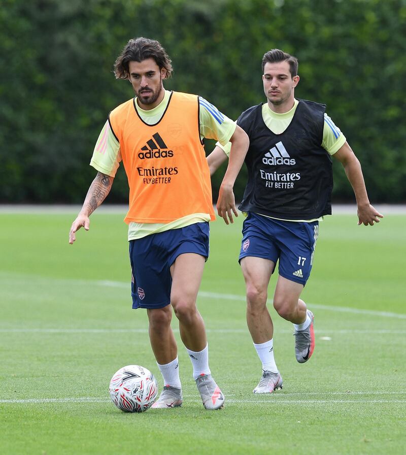 ST ALBANS, ENGLAND - JULY 29: (L-R) Dani Ceballos and Cedric of Arsenal during a training session at London Colney on July 29, 2020 in St Albans, England. (Photo by Stuart MacFarlane/Arsenal FC via Getty Images)
