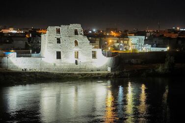 A night view of the ruins of the 13th century palace Qara Serai in Iraq's northern city of Mosul, on the seventh anniversary of the city's fall to ISIS. AFP