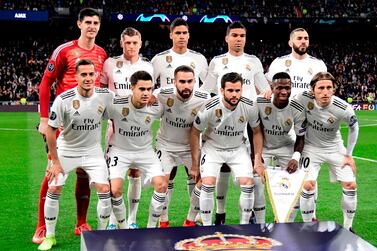 (FromL, top row) Real Madrid's Belgian goalkeeper Thibaut Courtois, Real Madrid's German midfielder Toni Kroos, Real Madrid's French defender Raphael Varane, Real Madrid's Brazilian midfielder Casemiro, Real Madrid's French forward Karim Benzema (bottom row) Real Madrid's Spanish midfielder Lucas Vazquez, Real Madrid's Spanish defender Sergio Reguilon, Real Madrid's Spanish defender Dani Carvajal, Real Madrid's Spanish defender Nacho Fernandez, Real Madrid's Brazilian forward Vinicius Junior and Real Madrid's Croatian midfielder Luka Modric pose before the UEFA Champions League round of 16 second leg football match between Real Madrid CF and Ajax at the Santiago Bernabeu stadium in Madrid on March 5, 2019. / AFP / JAVIER SORIANO