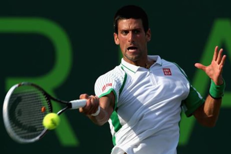 Novak Djokovic plays a forehand to Somdev Devvarman at the Sony Open in Miami.