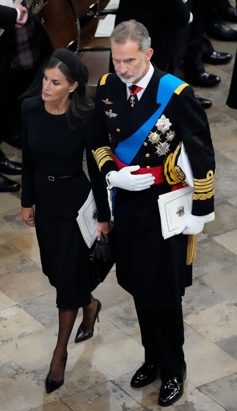 Spain's King Felipe VI and Queen Letizia leave the funeral. AFP