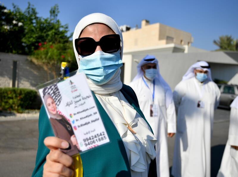 epa08774916 Khadija al-Qallaf, arrives to file candidacy papers for the upcoming parliamentary elections, at elections registration center in Kuwait City, Kuwait, 26 October 2020. Parliamentary elections in Kuwait are scheduled for 05 December.  EPA/NOUFAL IBRAHIM