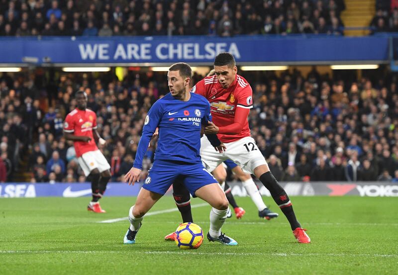 epa06310553 Chelsea Eden Hazard (L) vies for the ball against Manchester United Chris Smalling (R) during the English Premier League game between Chelsea and Manchester United at Stamford Bridge stadium in London, Britain, 05 November 2017.  EPA/FACUNDO ARRIZABALAGA EDITORIAL USE ONLY. No use with unauthorized audio, video, data, fixture lists, club/league logos or 'live' services. Online in-match use limited to 75 images, no video emulation. No use in betting, games or single club/league/player publications