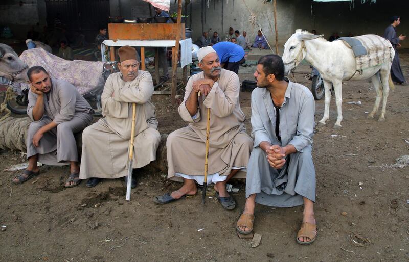 Vendors wait to sell their wares at a market ahead of Eid Al Adha in Ashmoun district, Manofiah, Egypt. EPA