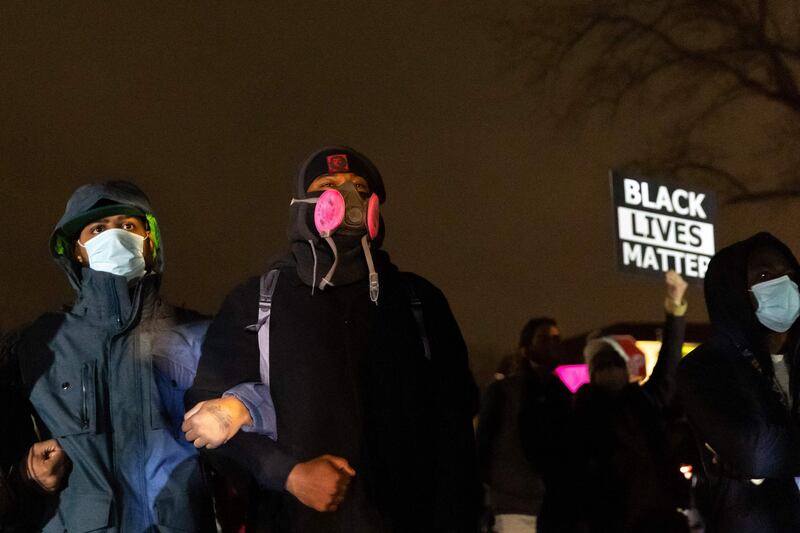 Protestors face off with police officers in front of the Brooklyn Centre Police Station after a 20-year-old man died following a police gunfire in Brooklyn Centre, Minneapolis, Minnesota. AFP