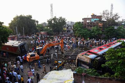 Carriages from the derailed North East Express passenger train strewn around Raghunathpur station, in Buxar district, Bihar state. AP