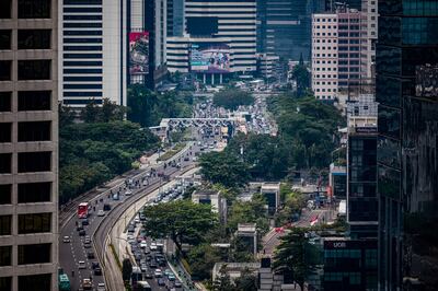 Motorists on their morning commutes in Jakarta. AFP