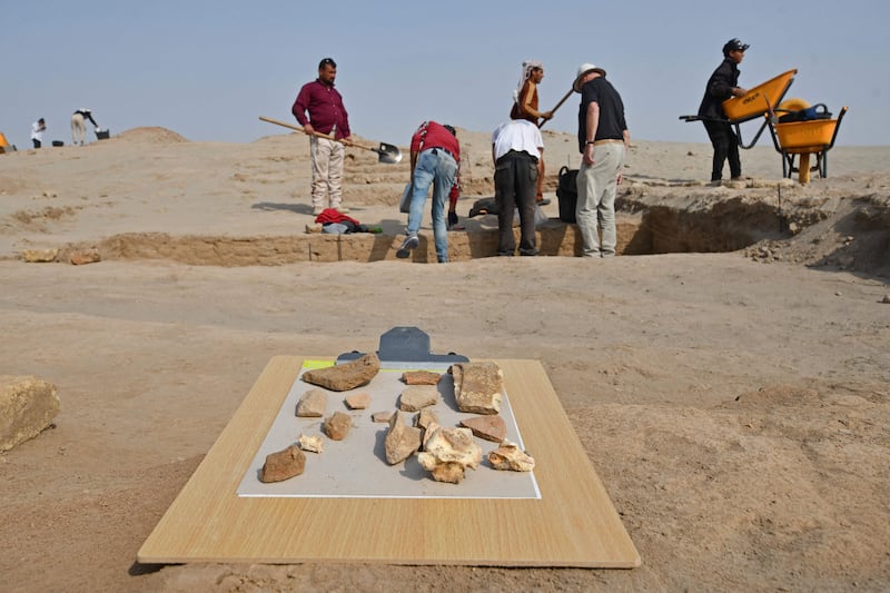 Members of a French-Iraqi archaeological expedition excavate at the site of the Sumerian city-state of Larsa, in the Qatiaah area of Iraq's southern province of Dhi Qar.