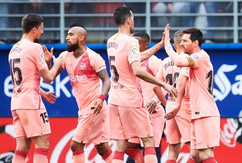 Messi celebrates with teammates after scoring a goal. Getty Images