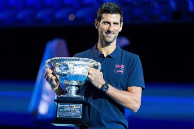 Novak Djokovic of Serbia poses with the men's singles championship trophy during the draw announcement of the Australian Open tennis tournament in Melbourne on January 16, 2020. IMAGE RESTRICTED TO EDITORIAL USE - STRICTLY NO COMMERCIAL USE
 / AFP / ASANKA BRENDON RATNAYAKE / IMAGE RESTRICTED TO EDITORIAL USE - STRICTLY NO COMMERCIAL USE
