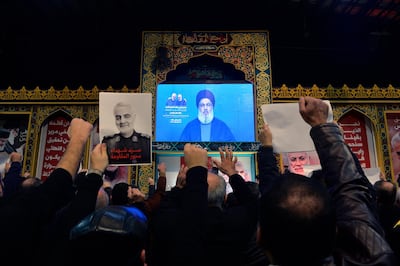 epa08104470 Supporters of Hezbollah listen to Hezbollah's Secretary-General Sayed Hassan Nasrallah as he delivers a speech on a screen during a mass rally to pay tribute the Iranian Revolutionary Guards Corps (IRGC) Lieutenant general and commander of the Quds Force Qasem Soleimani in the southern suburb of Beirut, Lebanon, 05 January 2020. The US Pentagon announced that Iran's Quds Force leader Soleimani and Iraqi militia commander Abu Mahdi al-Muhandis were killed on 03 January 2020 following a US airstrike at Baghdad's international airport. The attack comes amid escalating tensions between Tehran and Washington.  EPA/WAEL HAMZEH