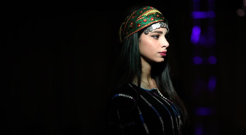 A model presents a creation during a 'Traditional Palestinian Dress and Heritage Day' fashion show in Nablus. EPA