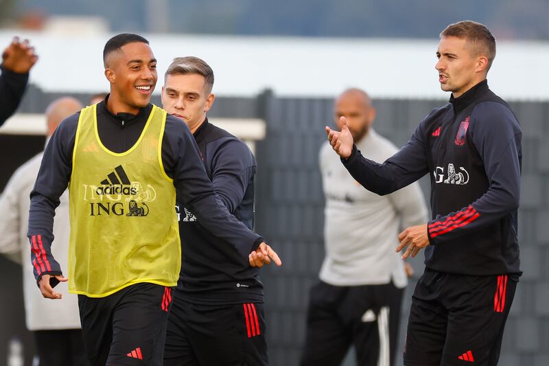 Youri Tielemans, left, shares a joke with Leicester City and Belgium teammate Timothy Castagne. EPA
