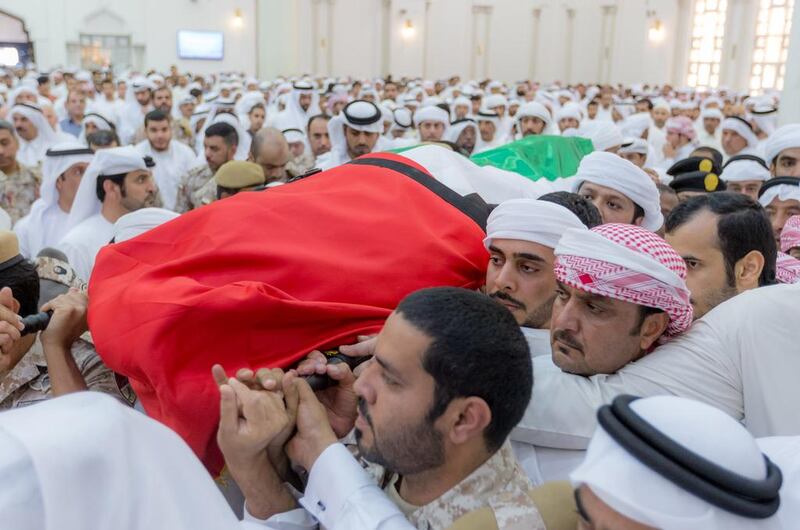 Sheikh Humaid bin Rashid, Ruler of Ajman, and Sheikh Ammar bin Humaid, the Crown Prince of Ajman, at the funeral for Abdullah Ali Hassan Al Hammadi, one of the 45 Emirati soldiers who died in Yemen on Friday. Wam