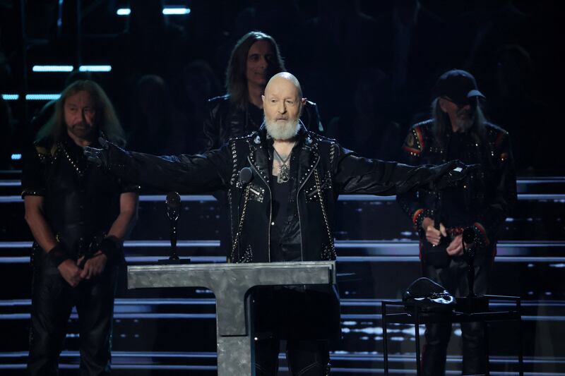 Musical Excellence Award recipients Judas Priest receive their trophy. Reuters