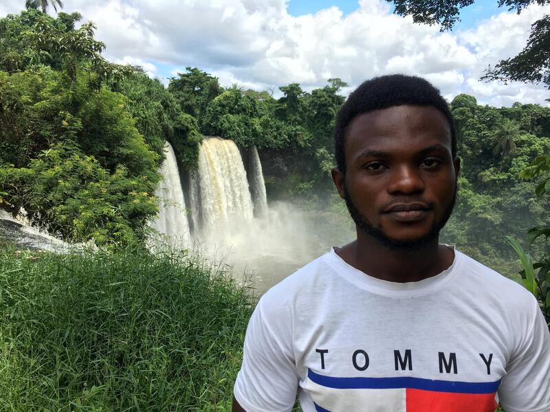An English-speaking refugee from Cameroon stands near the Agbokim Waterfalls on the Nigerian border. Colin Freeman for The National