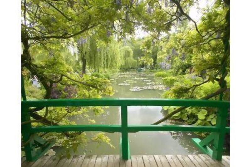 Above, the garden at Monet's house in Giverny. Right, the river at Argenteuil as painted by Monet in 1875. Getty Images / Visions of America / Joe Sohm