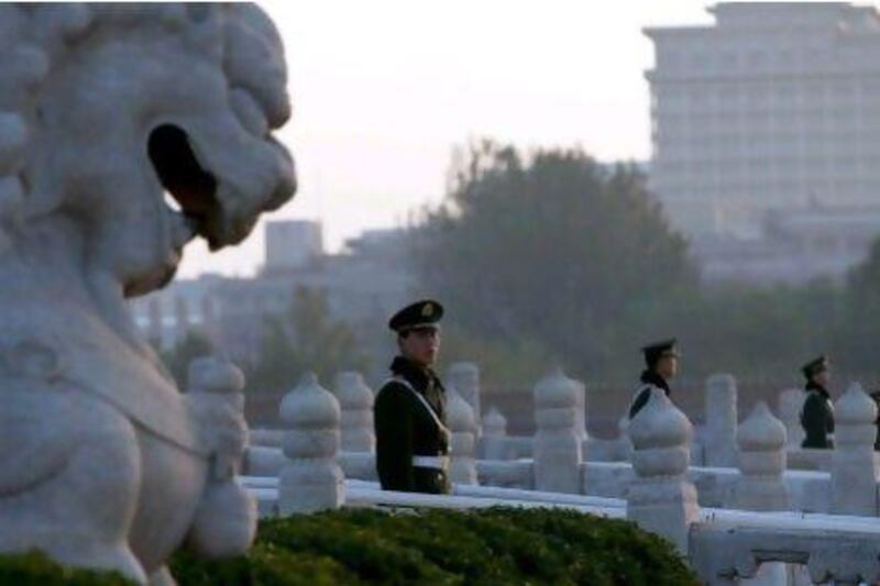 Chinese paramilitary policemen guard the bridges leading to Tiananmen Gate in Beijing. Authorities want no more surprises as party leaders convene in the capital to decide the country’s new leaders.