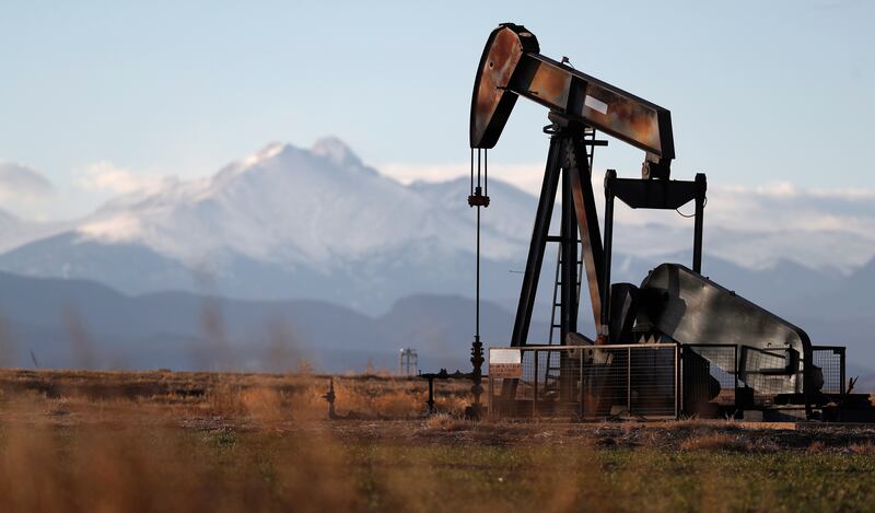 A pump jack sits at an oil well along Interstate 25 near Dacono, Colorado. AP