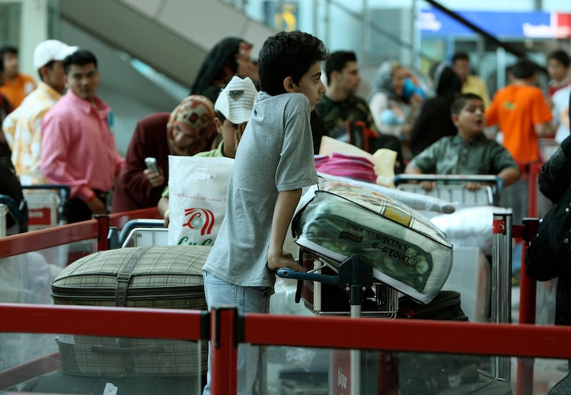 
SHARJAH, UNITED ARAB EMIRATES Ð April 6:  Passengers waiting for their turn at the Check-in area for the boarding pass at Sharjah International Airport in Sharjah. (Pawan Singh / The National) For Travel. Story by Scott
 *** Local Caption ***  PS13- SHARJAH AIRPORT.jpg TR11 SHARJAH AIRPORT 08.jpg