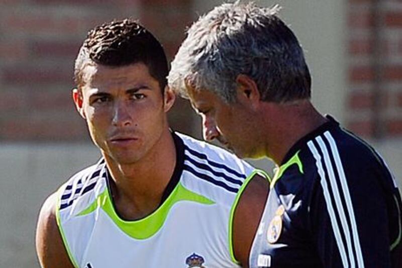 Jose Mourinho, right, has not given up hope of using Cristiano Ronaldo in tonight's clash with Tottenham Hotspur.