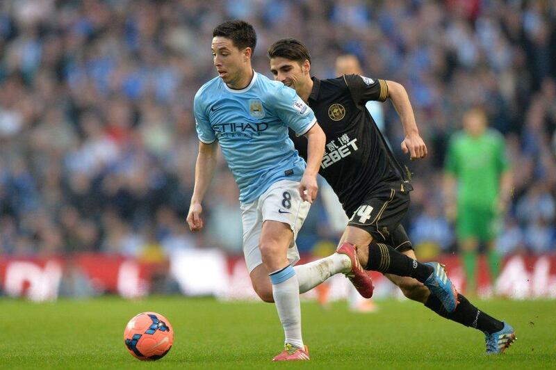 Samir Nasri and Manchester City travel to Barcelona looking to overcome a 2-0 deficit from the first leg. Paul Ellis / AFP  